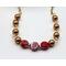 3 richly colored maroon faceted coin beads with gold swarovski pearls on gold chain